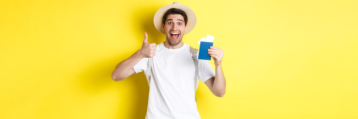 tourism-vacation-satisfied-male-tourist-showing-passport-with-tickets-thumb-up-recommending